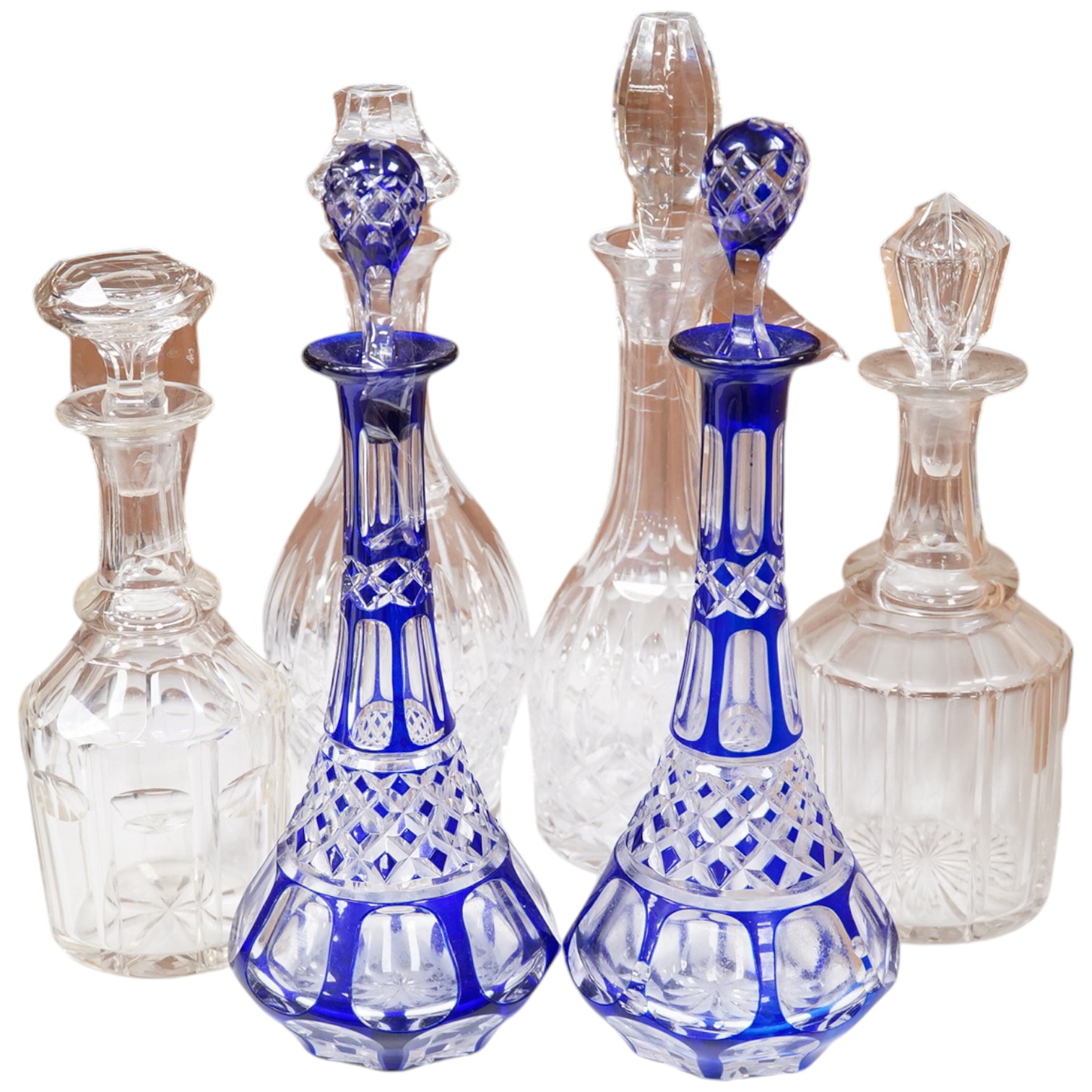 A near pair of blue flashed decanters and stoppers and four other decanters and stoppers, tallest blue flash decanter and stopper, 34cm high (6). Condition - fair to good